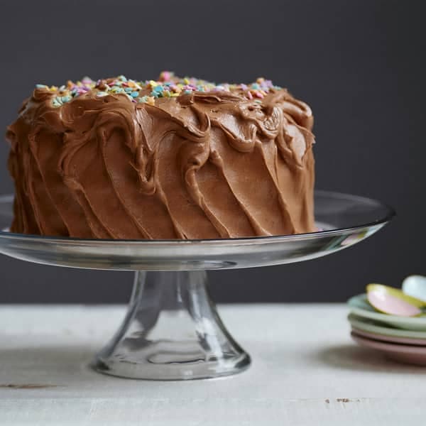 A layered cake on a stand